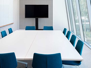 Modern workplaces support hybrid working by providing both collaborative areas and quiet, enclosed spaces 