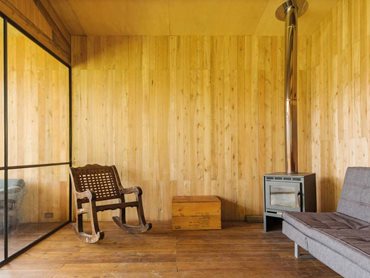 The rustic house features a modular design with clear functional areas 