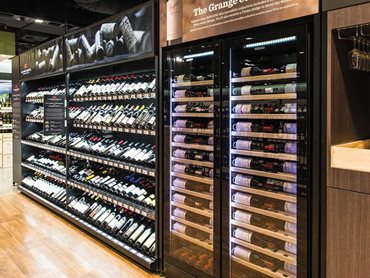 The wine cabinets are configured with specially designed wooden shelves to lay bottles with labels facing and parallel to the glass doors to optimise visibility and accessibility
