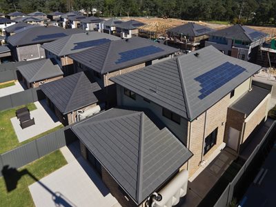 Aerial view of houses with solar roof tiles