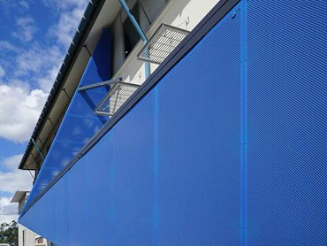 Each panel was precision punched and cut to create the angular, dynamic facade and finished in on-brand blue