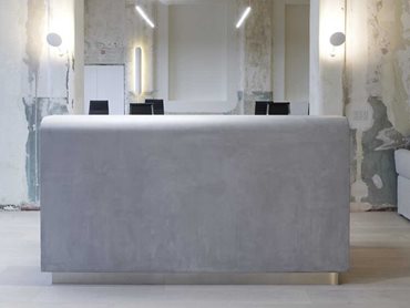 Concrete looking joinery created with X-Bond. Image of X-Bond reception desk