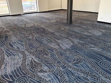The detailed emu design on the carpet incorporates the waterways that feed the emus