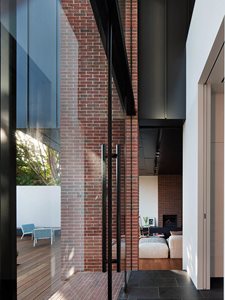 detailing red brick glass door black aluminium residential