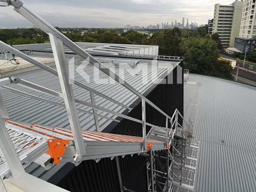 KOMBI access stairs and platforms at Junction Oval provide safe roof access to maintenance and television crews