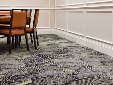 Signature Studio supplied semi-custom modular carpet tiles to the club project