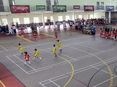 sports hall floor children playing football