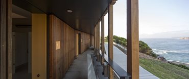 Precast concrete communal wash troughs are placed outside to free up space inside the building for the much needed additional toilets. Photography by Brett Boardman