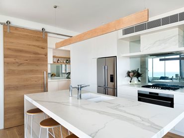 The kitchen in the 8 Berner Street residence featuring Havwoods HW961 Amendo timber 