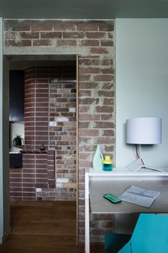 The feature walls in the apartments were created with recycled bricks. Photography by Brigid Arnott. 