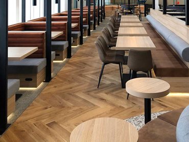 The timber flooring provides an earthy grounding and luxurious element to the dining area and tasting table