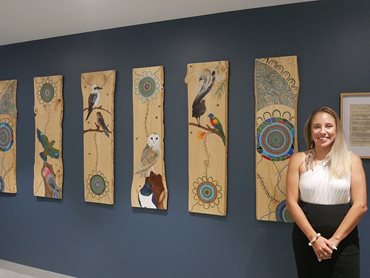 First Nations artist Tamay Beam with her artwork 