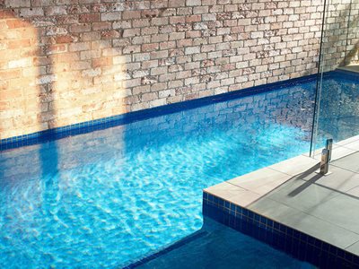 swimming pool reclaimed brick wall