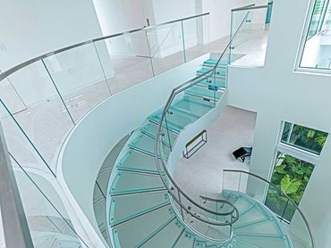The materials are predominantly made up of glass, including the multi-laminated stair treads