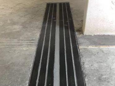The carpark slabs were strengthened around the pillars using a unique combination of carbon fibre laminate and carbon rods