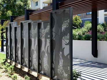 Bespoke leaf design perforated metal screens installed as walkway panels at Riverview