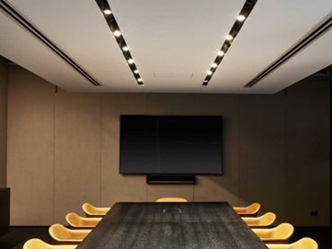 The boardroom has dropped plasterboard ceilings that feature the guide recessed track system with Guide Focus 55 track spotlights 