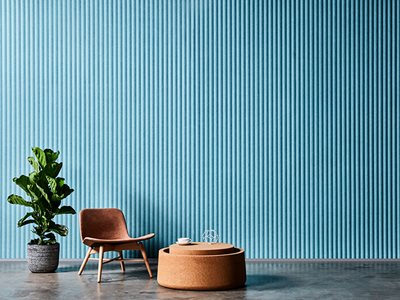 Woven Image Acoustic Embossed Panels Blue with Seating and Plant Arrangement