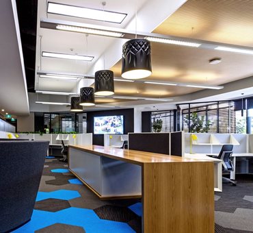 Carpet tiles were used by Graphite Architects at Mingara Leisure Group Corporate Offices, Newcastle. “[They] offered acoustic absorption [and] softness underfoot… [while still being] firm enough to feel like a commercial environment,” says Principal Design Architect, Sandy Strazds. Image: Graphite Architects