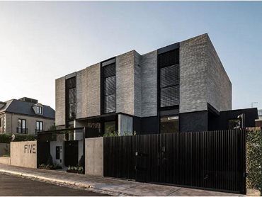 Le Cube uses a limited palette of Petersen Kolumba bricks, glazed stucco, precast concrete fencing and black steel accents