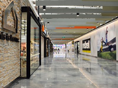 Interior of shopping centre corridor featuring resin flooring