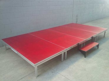 PILOT portable stage system featuring the red timber stain finish