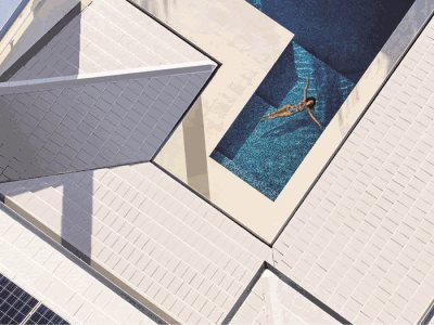 woman swimming pool white roof solar tiles