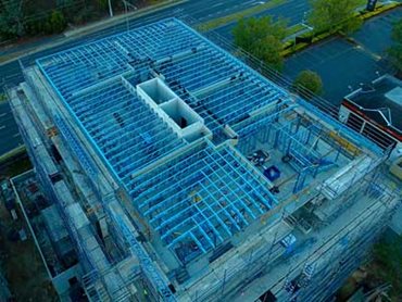 SBS Group supplied prefabricated top level wall and roof truss framing 