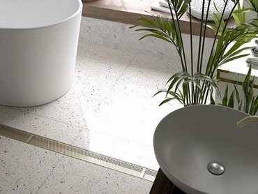 Stormtech Marc Newson designed linear drains in modern bathroom