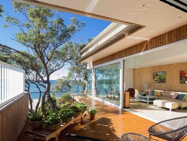 The solid CLT structure and timber cladding contribute significantly to the sustainability of the beach house