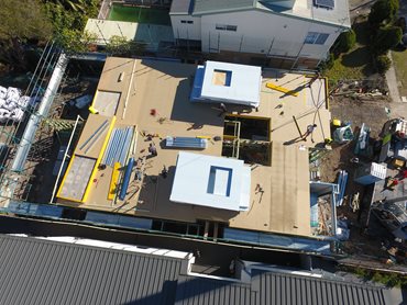 Day 5 - PanelUp walls delivered and stacked for second storey