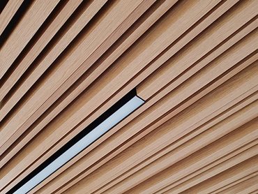 Detailed facade image of Covet concealed fix system Kabebari timber look battens