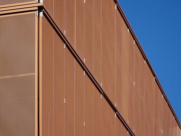 The bright copper finish transforms the functional facade into a show-stopping architectural feature