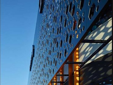 The Alpolic/fr panels feature large and small perforations to retain their rigidity