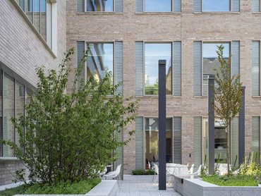 The hand cast glass bricks are recessed against the clear glass openings