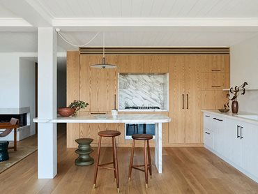 The use of timber extends beyond the floors to the walls and ceilings