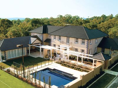 large home swimming pool dark concrete roof tiles