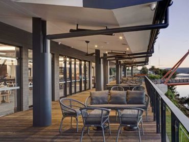 The sliding doors enable patrons to transition between bar and deck, effectively integrating the two areas