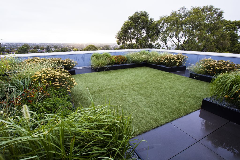 12556-Synthetic-turf-boarded-by-garden-beds-1.jpg