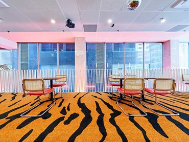 The custom carpet featured ‘big cat’ stripes in era-appropriate burnt orange.
