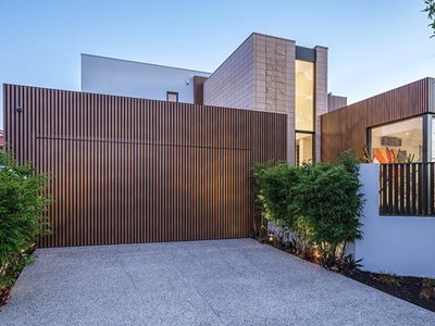 DecoWood Exterior Image of Residential Home with Tall Timber-Slatted Garage