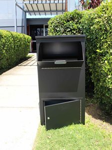 MailSafe Parcel Drop Box Opened in Front of Driveway Entrance