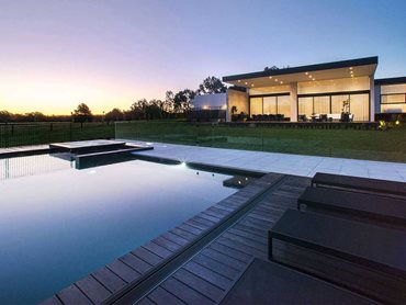 At night, illumination from the pool and residence transforms the atmosphere (Photo: Longshot Images) 