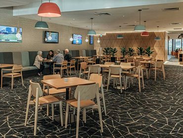 The pattern and colour of the carpet add warmth to the Dandenong RSL venue