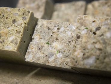Ground-up glass replaces natural mined sand in polymer concrete production