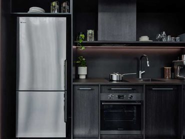 The kitchen is afforded the luxury of full-size appliances, truly highlighting that functionality is independent of scale
