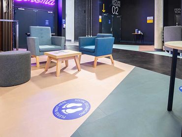 Café seating, meeting tables and softer breakout space make the area a destination for users