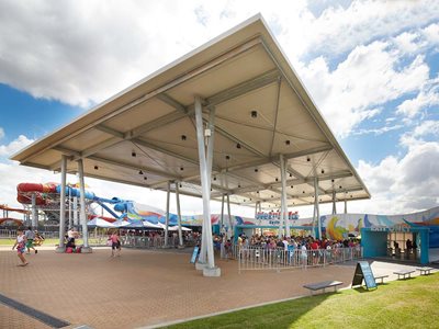 Integrated roofing and ceiling panel at Wet-n-Wild theme park