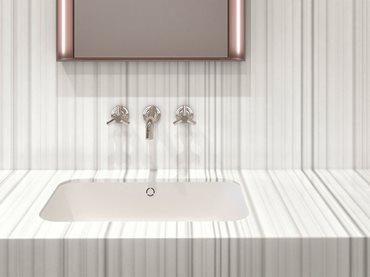 White modern bathroom basin with bronze mirror