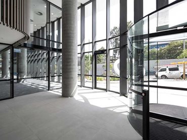 Macquarie Corporate Centre: The 2800mm high x 2000mm wide frameless glass door panel weighs 210kg 